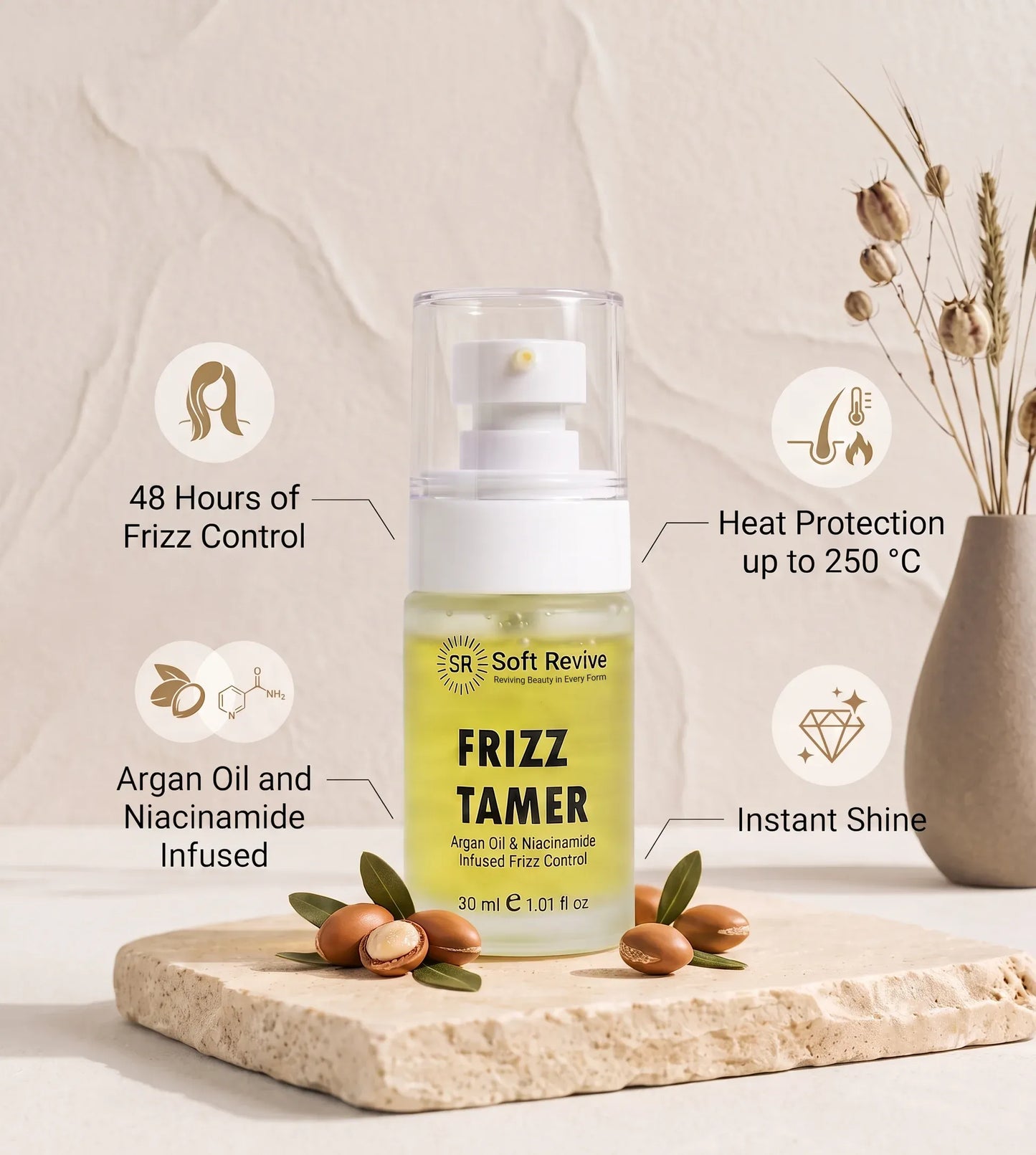 Soft Revive Frizz Tamer hair product bottle displayed on a stone slab with argan nuts, surrounded by informational callouts about frizz control, heat protection, and infused ingredients.